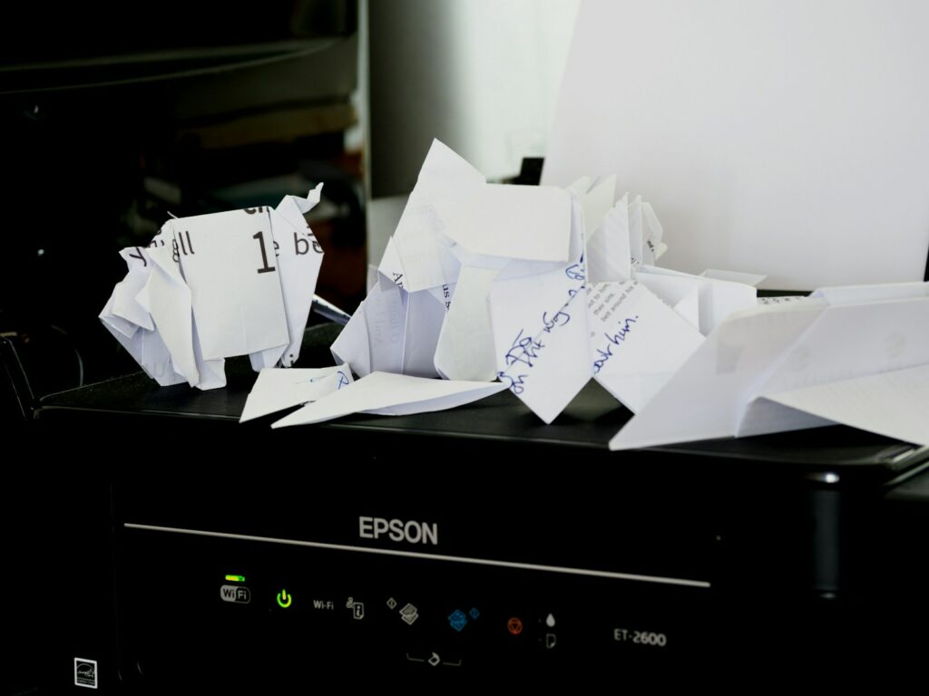 a pile of papers sitting on top of a black box