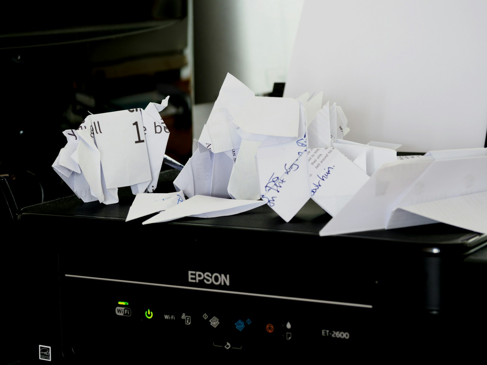 a pile of papers sitting on top of a black box